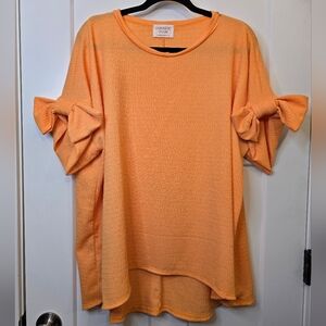 Fantastic Fawn Orange Top with Bow Sleeves